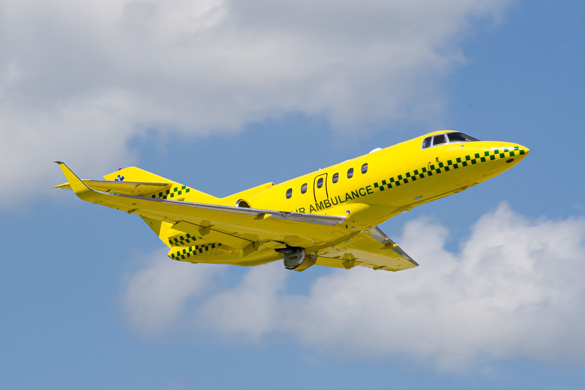 Private yellow Air Ambulance aircraft takeoff